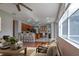 Open-concept living area with kitchen view, abundant light and hardwood floors is great for entertaining and Gathering time at 2237 Wintermere Pointe Dr, Winter Garden, FL 34787