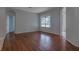 Bright living room with hardwood floors, and a large window offering natural light at 2237 Wintermere Pointe Dr, Winter Garden, FL 34787
