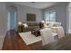 Inviting living room with hardwood floors, comfortable seating, and plenty of natural light creates a cozy atmosphere at 2237 Wintermere Pointe Dr, Winter Garden, FL 34787