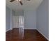 Spacious bedroom featuring hardwood floors and a bright color palette at 2237 Wintermere Pointe Dr, Winter Garden, FL 34787