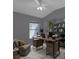 Stylish home office with modern desk, shelving, and cozy chair for a productive workspace at 2237 Wintermere Pointe Dr, Winter Garden, FL 34787