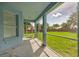 Covered patio with screened walls providing clear views of the lush backyard and brick fencing at 2237 Wintermere Pointe Dr, Winter Garden, FL 34787