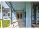 Covered patio featuring a view to the kitchen through sliding glass doors at 2237 Wintermere Pointe Dr, Winter Garden, FL 34787
