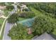 Well-maintained community tennis court and playground surrounded by lush greenery in a quiet neighborhood at 2237 Wintermere Pointe Dr, Winter Garden, FL 34787