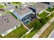Aerial shot of a home featuring a screened-in pool, fenced yard, and well-manicured lawn at 2355 White Lilly Dr, Kissimmee, FL 34747