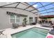Beautiful backyard featuring a pool, an outdoor kitchen, and comfortable seating areas at 2355 White Lilly Dr, Kissimmee, FL 34747