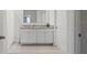 Bright bathroom with a double vanity and a large mirror, offering lots of counter space at 2355 White Lilly Dr, Kissimmee, FL 34747