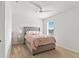Cozy bedroom featuring a plush bed with stylish headboard and modern ceiling fan at 2355 White Lilly Dr, Kissimmee, FL 34747