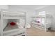 Bright bedroom with two white bunk beds, ideal for or a guest room at 2355 White Lilly Dr, Kissimmee, FL 34747
