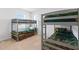 Shared ' bedroom featuring two gray bunkbeds with animal print bedding at 2355 White Lilly Dr, Kissimmee, FL 34747