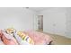 Bright bedroom with stylish comforter and lots of natural light from the windows at 2355 White Lilly Dr, Kissimmee, FL 34747