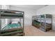Neutral shared ' room showing two gray bunkbeds with cool animal print bedding at 2355 White Lilly Dr, Kissimmee, FL 34747