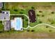 Aerial shot highlighting community amenities, including a pool, playground, and lush green spaces at 2355 White Lilly Dr, Kissimmee, FL 34747