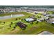 Sprawling aerial view showing community amenities, including a pool, playground, and multiple ponds at 2355 White Lilly Dr, Kissimmee, FL 34747