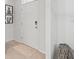Bright entryway with a white door, neutral-toned rug, and decorative accents at 2355 White Lilly Dr, Kissimmee, FL 34747