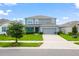 Beautiful two-story home with a well-maintained lawn and inviting curb appeal at 2355 White Lilly Dr, Kissimmee, FL 34747