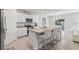 Bright kitchen with white cabinets, stainless steel appliances, and granite countertops at 2355 White Lilly Dr, Kissimmee, FL 34747
