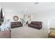 Spacious living room with plush sofas, stylish decor, and plenty of natural light at 2355 White Lilly Dr, Kissimmee, FL 34747