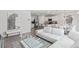 Interior shot of a living space with a modern sofa, glass table, and view of kitchen and dining areas at 2355 White Lilly Dr, Kissimmee, FL 34747