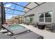 Relaxing screened-in pool area with stylish patio furniture and a serene atmosphere at 2355 White Lilly Dr, Kissimmee, FL 34747
