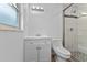 Well lit bathroom with tiled shower, modern fixtures, and white vanity at 241 Brittany Ave, Port Orange, FL 32127