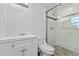 Modern bathroom features a glass shower door and updated vanity with quartz countertops at 241 Brittany Ave, Port Orange, FL 32127