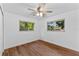 Inviting bedroom with hardwood floors and natural light streaming through the windows at 241 Brittany Ave, Port Orange, FL 32127