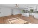 Open-concept kitchen featuring stainless steel appliances, white cabinetry, and a center island with bar seating at 241 Brittany Ave, Port Orange, FL 32127
