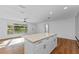 Bright open kitchen featuring a large center island with granite countertops at 241 Brittany Ave, Port Orange, FL 32127
