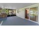 A large sliding glass door connects the screened-in patio and features a brick fireplace to the main living area at 241 Brittany Ave, Port Orange, FL 32127