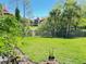 Well-manicured backyard with lush green grass and views of neighboring buildings at 249 Afton Sq # 112, Altamonte Springs, FL 32714