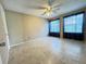 Spacious bedroom featuring tile floors, a ceiling fan and bright windows with dark curtains at 249 Afton Sq # 112, Altamonte Springs, FL 32714