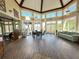 Expansive community clubhouse with vaulted ceilings, natural light, and view of lush landscaping at 249 Afton Sq # 112, Altamonte Springs, FL 32714