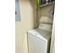 Cozy laundry room including a washing machine and wire shelving unit for storage at 249 Afton Sq # 112, Altamonte Springs, FL 32714