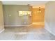 Open-concept living room with a pass-through to the kitchen and plenty of natural light at 249 Afton Sq # 112, Altamonte Springs, FL 32714
