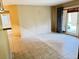 Bright and spacious living room with tile flooring and sliding glass doors to a patio at 249 Afton Sq # 112, Altamonte Springs, FL 32714