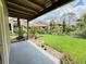 Scenic patio view overlooking a lush green lawn and beautifully landscaped gardens at 249 Afton Sq # 112, Altamonte Springs, FL 32714