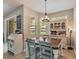 Charming dining area with a sliding door to the backyard and a stylish hutch at 2579 Woodside Ridge Dr, Apopka, FL 32712