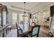 Elegant dining room featuring a coffered ceiling and hardwood flooring at 2579 Woodside Ridge Dr, Apopka, FL 32712