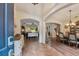 Inviting entryway featuring tile flooring, archways, and an open floor plan at 2579 Woodside Ridge Dr, Apopka, FL 32712