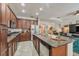 Gourmet kitchen with granite countertops, stainless steel appliances, and a functional center island at 2579 Woodside Ridge Dr, Apopka, FL 32712