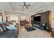 Inviting living room featuring comfortable leather seating and stylish entertainment center with electric fireplace at 2579 Woodside Ridge Dr, Apopka, FL 32712