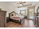 Tranquil main bedroom featuring ample natural light and backyard/pool views at 2579 Woodside Ridge Dr, Apopka, FL 32712