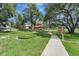 Community park featuring a gazebo, walking path, and open green space, creating a serene environment for residents to enjoy at 2579 Woodside Ridge Dr, Apopka, FL 32712