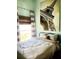 Comfortable bedroom featuring an Eiffel Tower art piece, soft lighting, and stylish window treatments at 2650 Autumn Creek Cir, Kissimmee, FL 34747