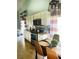 Well-lit kitchen with modern appliances, a cozy dining area, and stylish granite countertops at 2650 Autumn Creek Cir, Kissimmee, FL 34747