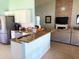 Modern kitchen featuring stainless steel appliances, granite countertops, and an open layout at 2650 Autumn Creek Cir, Kissimmee, FL 34747
