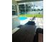 Relaxing screened lanai featuring an in-ground pool and comfortable seating area at 2650 Autumn Creek Cir, Kissimmee, FL 34747
