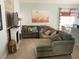 Spacious living room with a fireplace, comfortable seating, and stylish decor at 2650 Autumn Creek Cir, Kissimmee, FL 34747