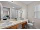 Bright bathroom with a single sink, spacious vanity, and shower-tub combination at 2717 Camaro Dr, Kissimmee, FL 34746
